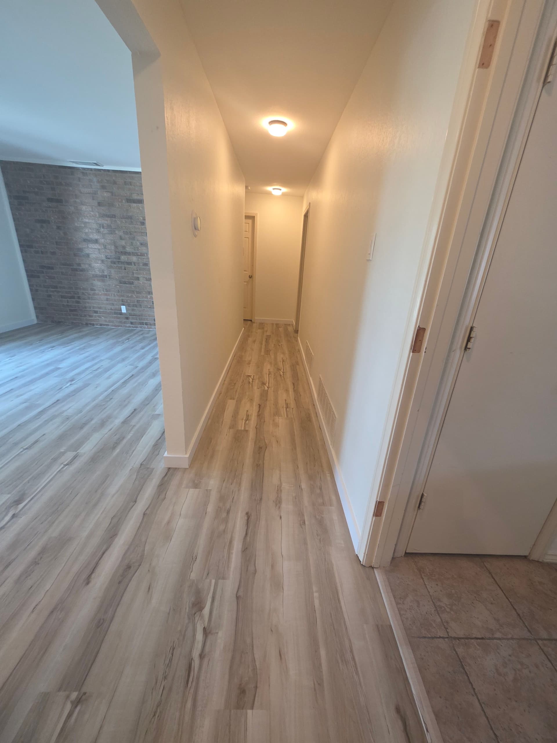 Gallery photos for Worn Carpet and Tile Replaced With Clean LVP Floors: Image #4