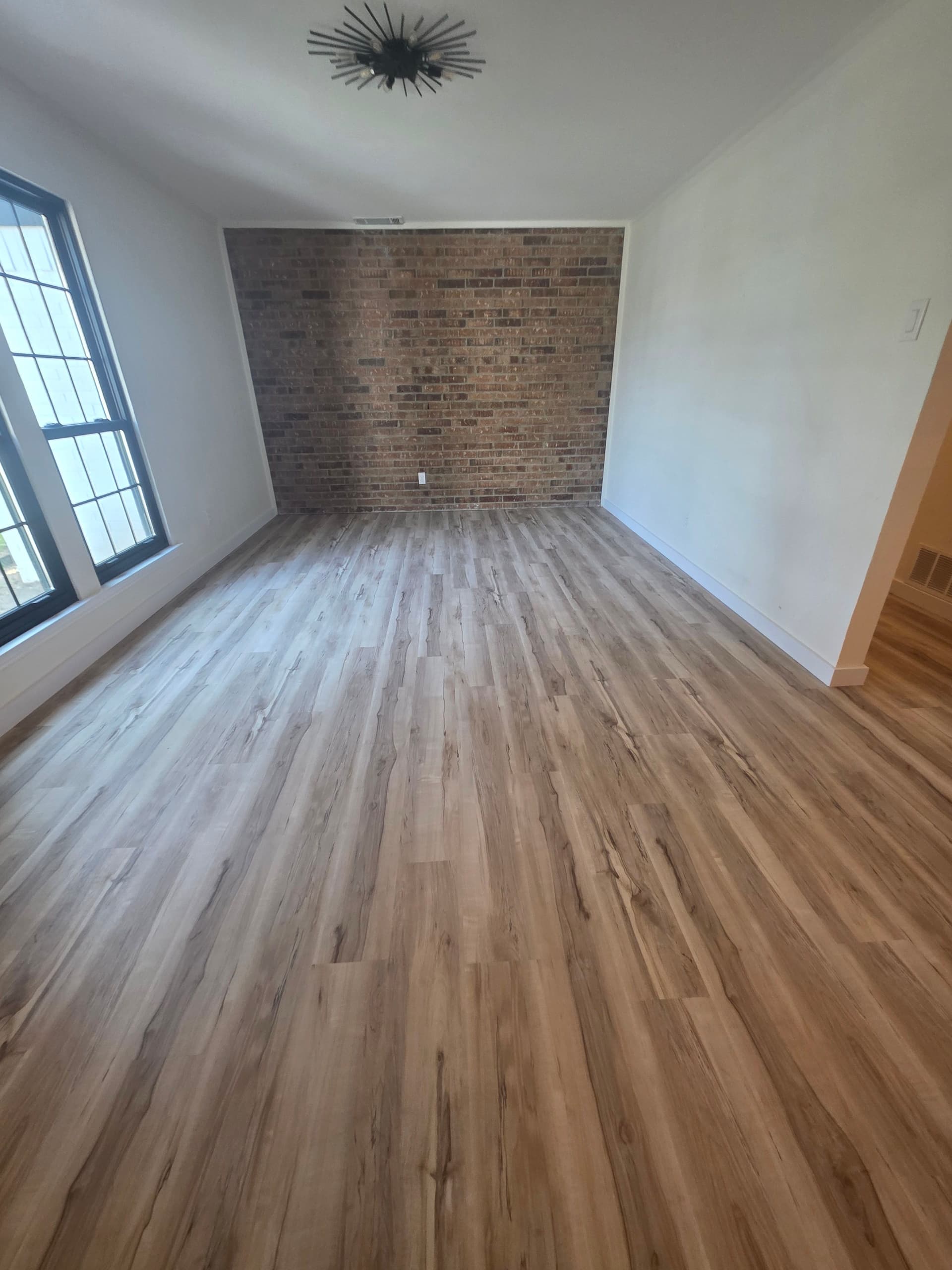 Gallery photos for Worn Carpet and Tile Replaced With Clean LVP Floors: Image #2